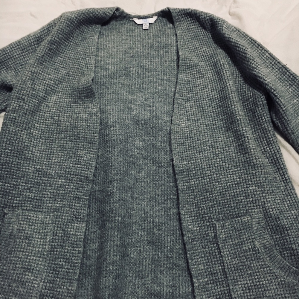 Really soft material, gray, and has pockets!